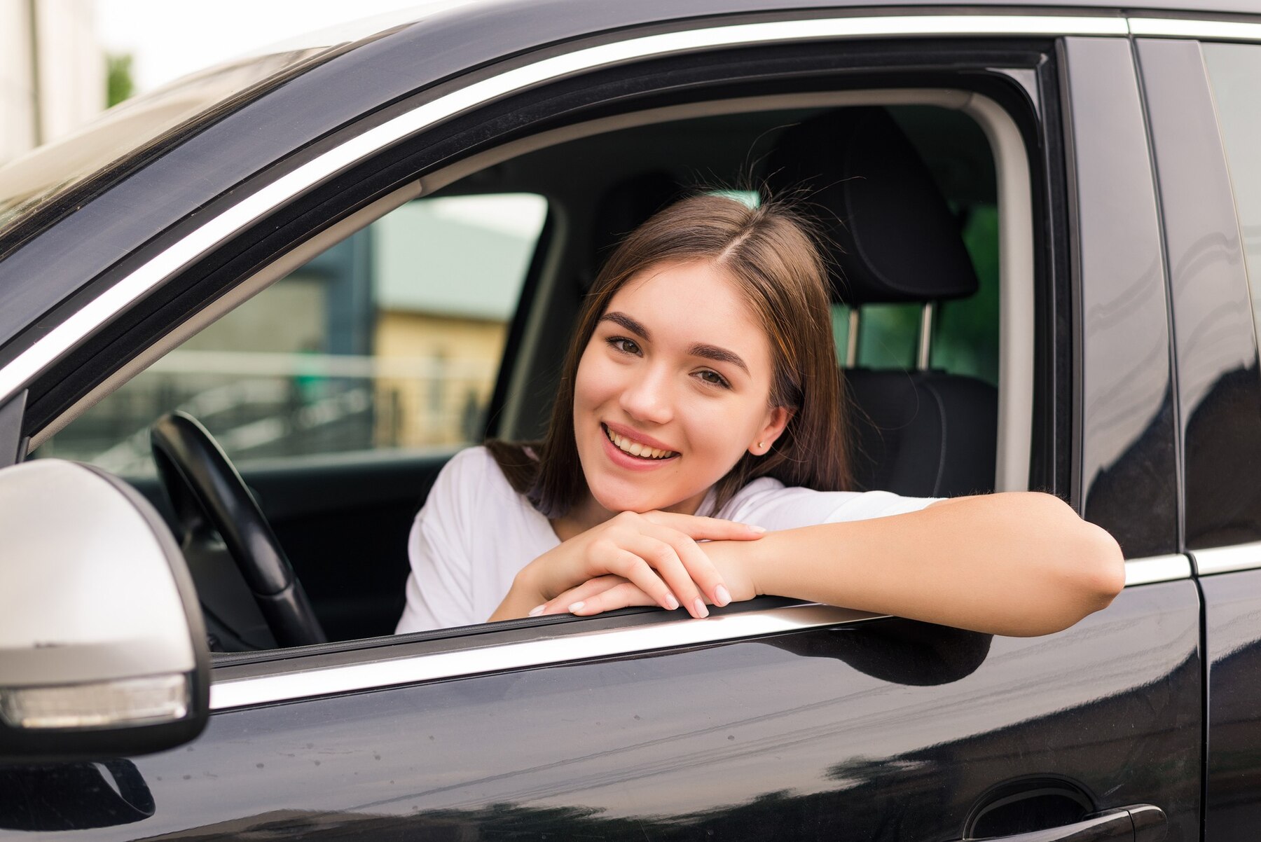 relaxed-happy-woman-summer-roadtrip-travel-vacation-leaning-out-car-window-blue-sky-wall_231208-11929